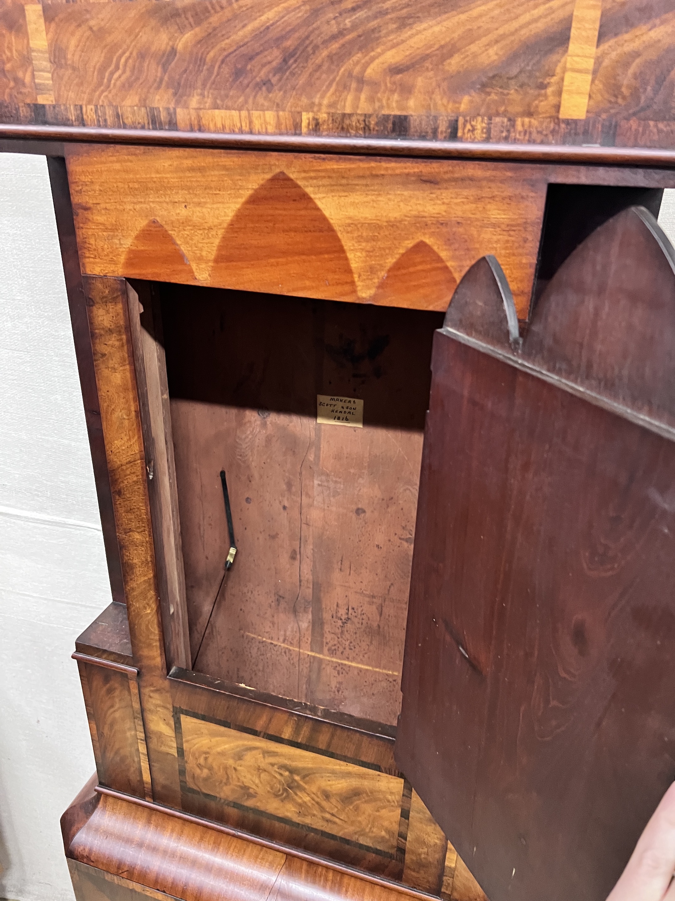 Scott & Son, Kendall. An early 19th century flame mahogany longcase clock, height 230cm